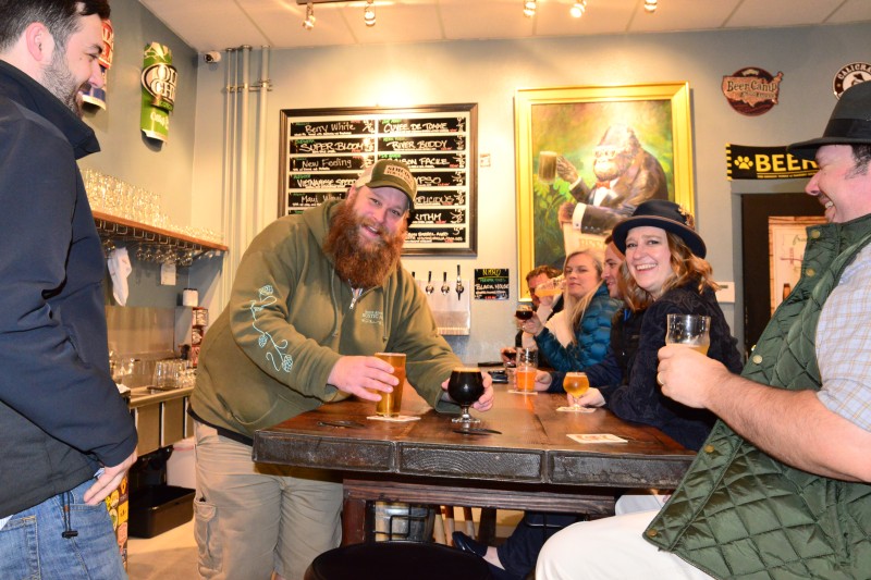Beer-tender Jeff Russell serves people craft beer at the taproom in Rohnert Park. (Tim Vallery) 