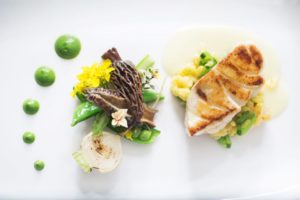 Maryland striped seabass with shrimp arancini, early spring vegetables, Meyer lemon olive oil emulsion and spinach pudding at Farmhouse Inn in Forestville. (Charlie Gesell / Sonoma Magazine)