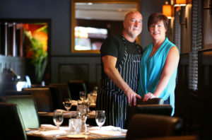 7/27/2014:A1: DINING DYNAMOS: Mark and Terri Stark in the dining room at Starks Steak & Seafood in Santa Rosa earlier this month. Between 2003 and 2012, the pair opened three restaurants in Santa Rosa and two in Healdsburg, each with its own style. They plan a sixth at the former The Italian Affair in downtown Santa Rosa. PC: Mark and Terri Stark at Stark's Steak & Seafood, in Santa Rosa on Tuesday, July 8, 2014. The couple also owns Bravas Bar De Tapas, Willi's Wine Bar, Willi's Seafood & Raw Bar, and Monti's Rotisserie & Bar, and are getting ready to open a sixth restaurant in Sonoma County. (Christopher Chung/ The Press Democrat)