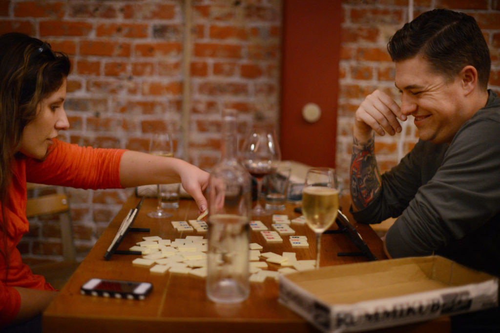 Christina and Mike Velzo, both from Chicago, playing Rummikub, one of the many games available at Bergamot Alley Bar & Wine Merchants in Healdsburg. February 24, 2014. (Photo: Erik Castro/for The Press Democrat)