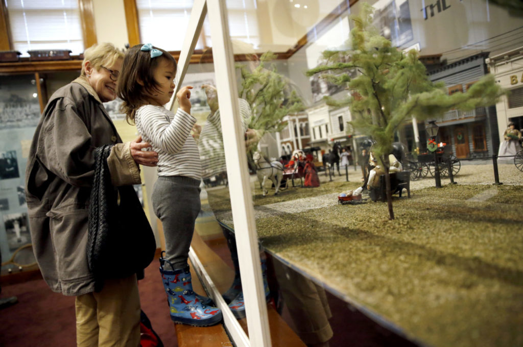Nancy Oliver and her granddaughter Suri, 1, look at a model of the Healdsburg square circa 1915 during the Model Train Spectacular! event at the Healdsburg Museum in Healdsburg, on Sunday, November 26, 2017. (Beth Schlanker / The Press Democrat)