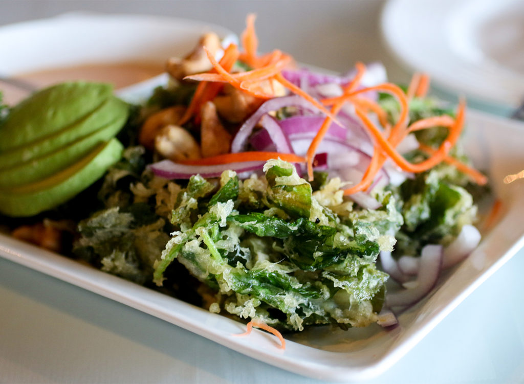 Fried spinach salad with cashews, avocado, red onion and creamy vinaigrette at Spring Thai in Cotati. (Heather Irwin/Sonoma Magazine)