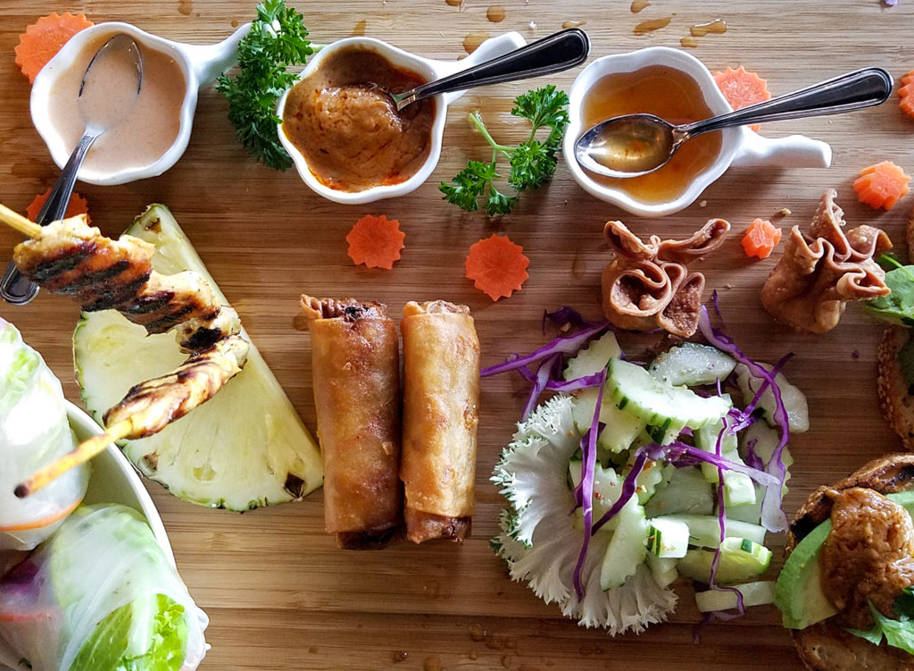 Start parade of egg rolls, cucumber salad, satay, spring rolls, crab purses and sauces at Spring Thai in Cotati. Heather Irwin/PD