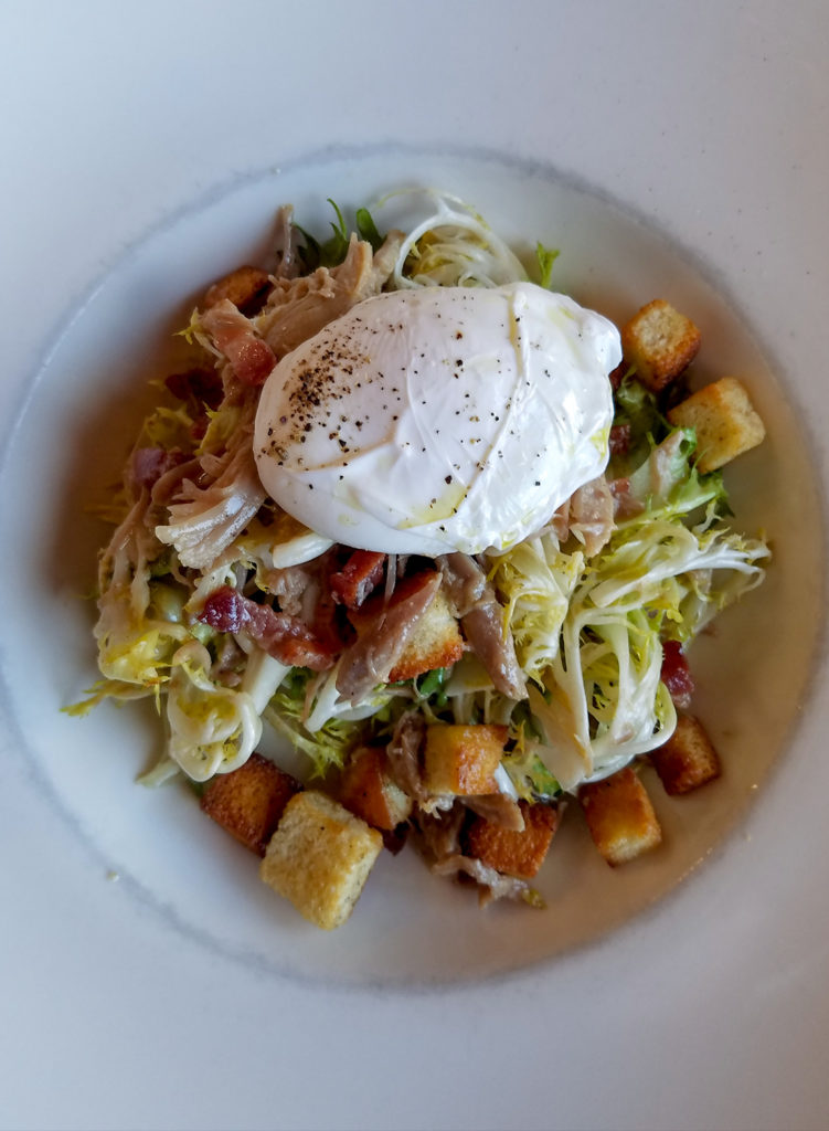 Frisee salad with lardons at Bistro 29 in Santa Rosa, one of the best Sonoma County restaurant dishes of 2017. Heather Irwin/PD