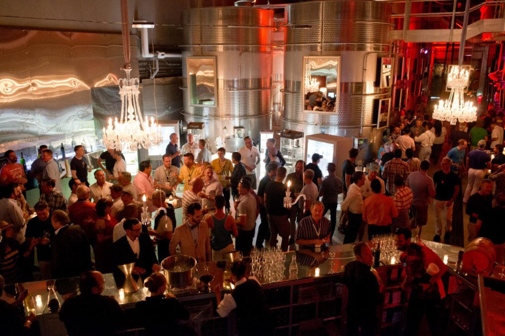 The party begins in Raymond Vineyard's Crystal Cellar during Out in the Vineyard's Twilight T-Dance, benefitting Face to Face Sonoma County AIDS Network, during Gay Wine Weekend in St. Helena, California, on June 14, 2014. (Alvin Jornada / For The Press Democrat)