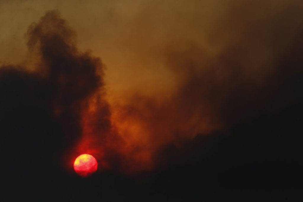 The sun rises over fire smoke on Monday, October 9, 2017 in Kenwood, California . (BETH SCHLANKER/The Press Democrat)