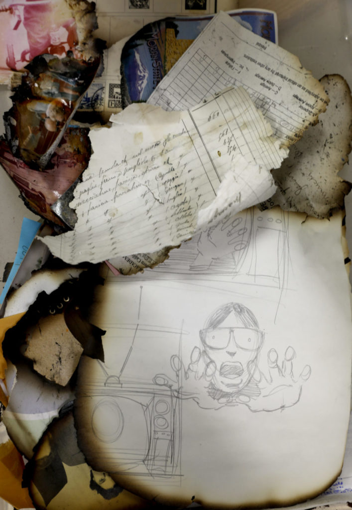 Photographs and papers damaged by the recent fires have been found and sent to Donald Laird, Chair of Computer Studies Dept., and his son, Sutter, who are collecting them and working to reunite them with their owners. Photo taken in his classroom at the Santa Rosa Junior College in Santa Rosa, on Sunday, October 29, 2017. (BETH SCHLANKER/ The Press Democrat)