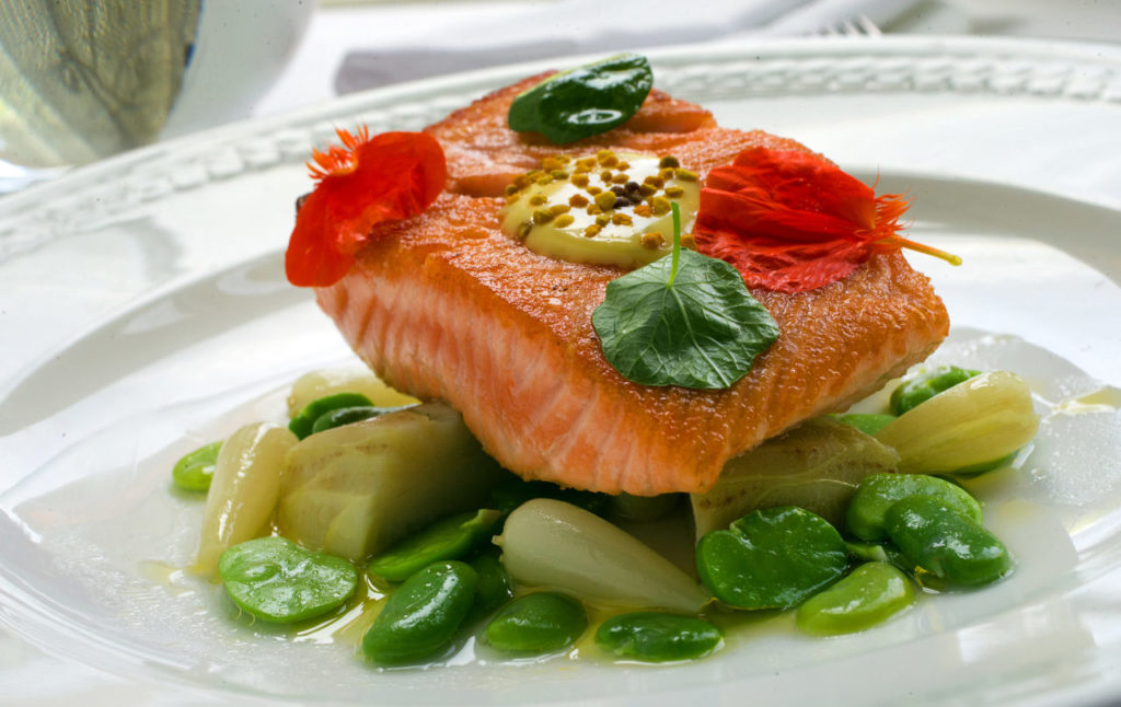 King Salmon with fava bean puree, spring garlic, estate Meyer lemon and society garlic flowers from Madrona Manor in Healdsburg. (photo by John Burgess/The Press Democrat)
