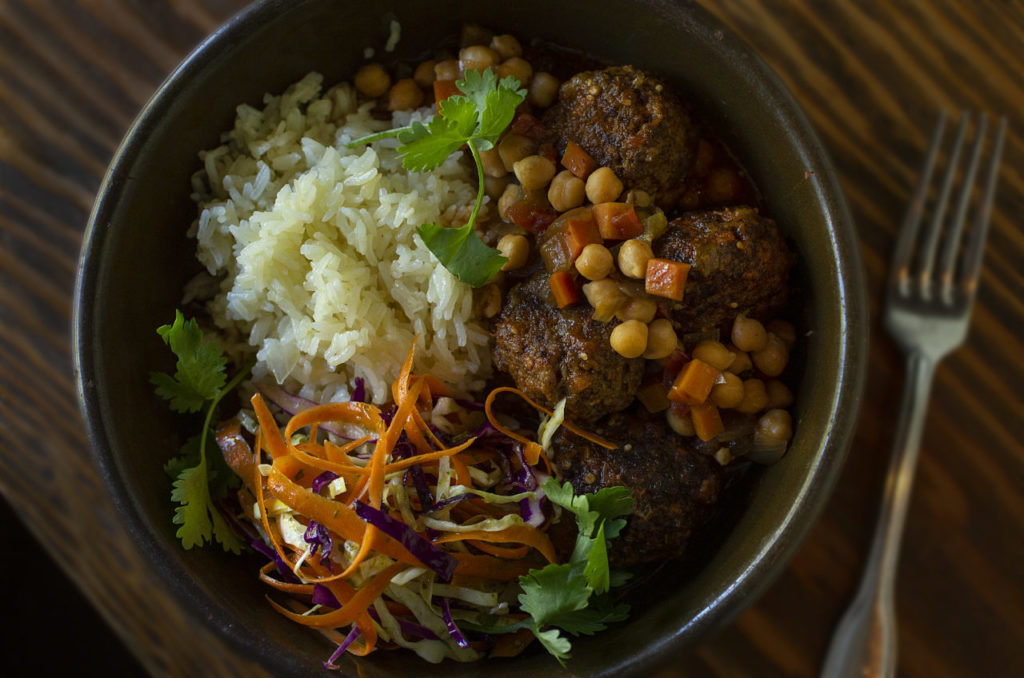 Albondigas: meatballs with tomatillo sauce, stewed garbanzo beans, cabbage salad, cilantro-lime vinaigrette and spiced carrots from the Harvest Moon Cafe on the square in Sonoma. (photo by John Burgess/The Press Democrat)
