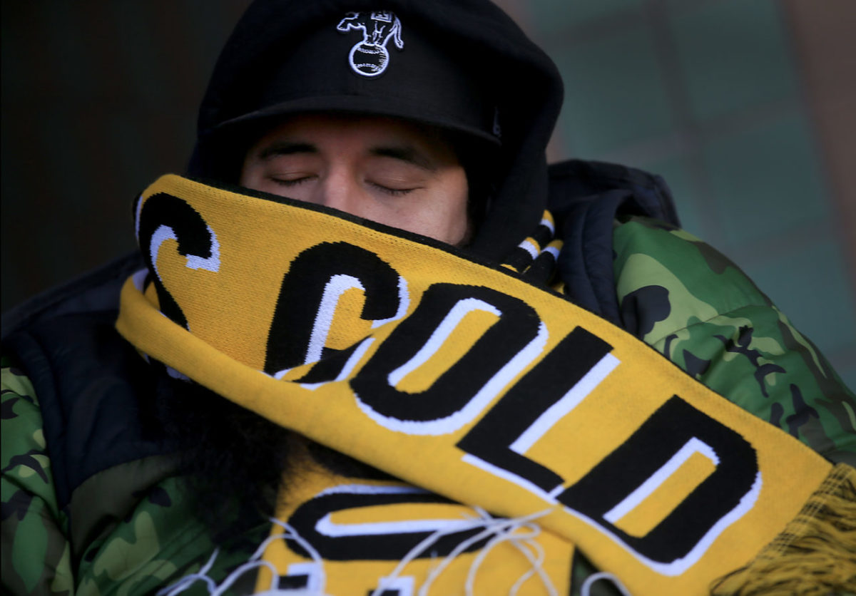 Mark Garza of McAllen, Texas bundles up against the 37 degree temperatures as he waits for the release of Pliny the Younger at the Russian River Brewing Co. in Santa Rosa, Friday Feb. 5, 2016. The temperature in McAllen? 61. (Kent Porter / Press Democrat) 2016