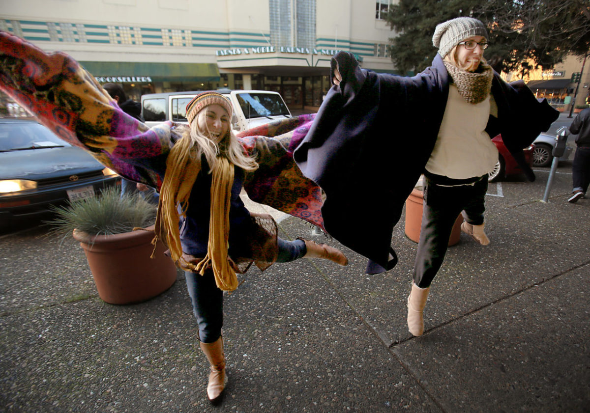 Jessica Arm and Shannon Rivers of San Francisco, entertain their friends with dance moves as they wait in line for the release of Pliny the Younger at the Russian River Brewing Co. in Santa Rosa, Friday Feb. 5, 2016. (Kent Porter / Press Democrat) 2016J