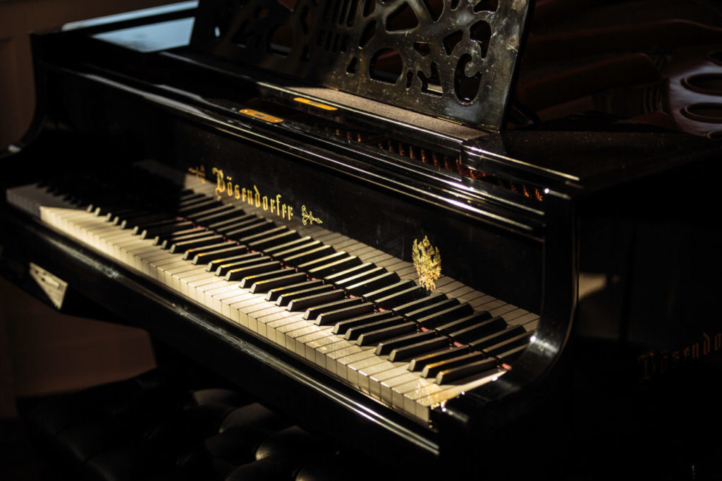 Chris and Barbara Montan in their house in Sonoma that used to be owned by Hap Arnold Piano in the entry way
