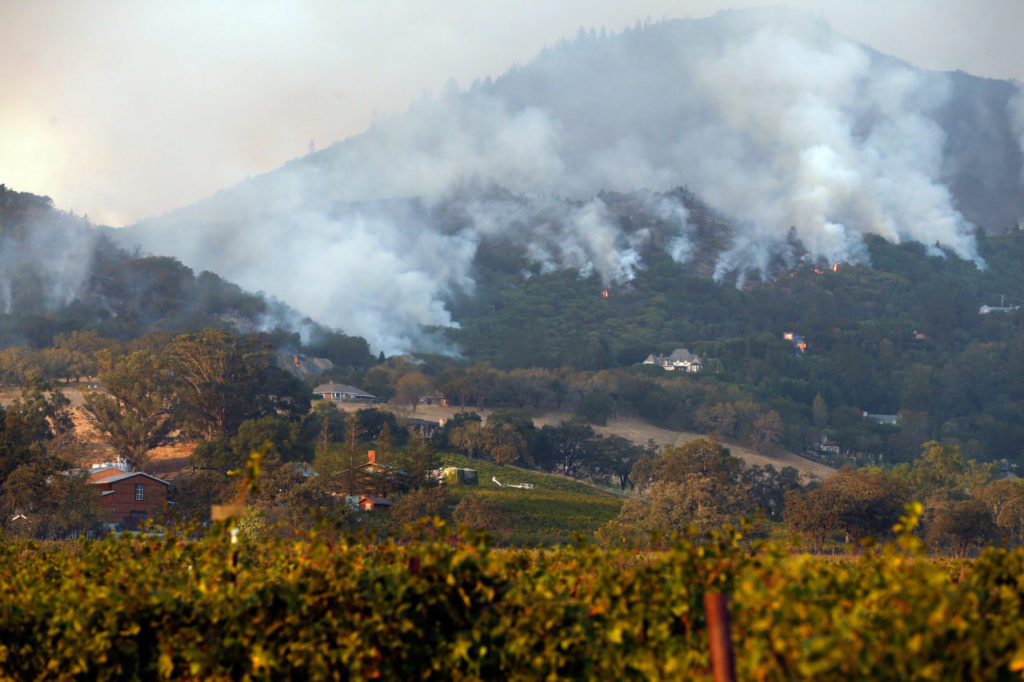 Flames descend the hillside, approaching homes overlooking Kenwood Vineyards, in Kenwood, California on Tuesday, October 10, 2017. (Photo by Alvin Jornada)