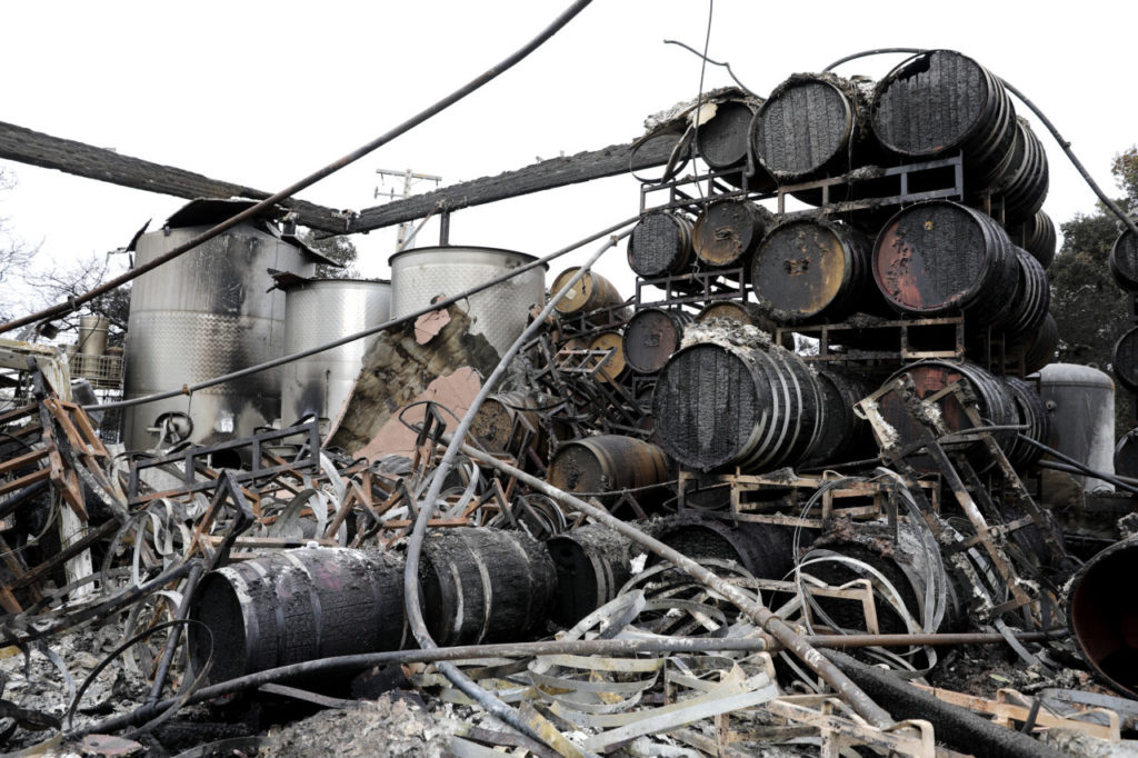 Charred wine barrels and holding tanks are all that remain of the winery building at Paradise Ridge Winery in Santa Rosa, on Thursday, October 19, 2017. (Photo by Beth Schlanker)
