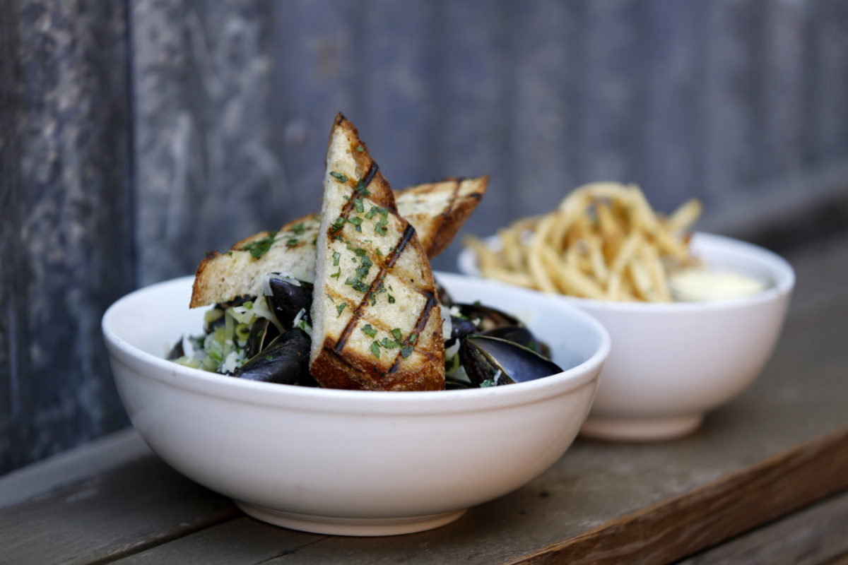 Pastis-scented steamed mussels and fries at the Girl & the Fig in Sonoma. (Beth Schlanker/The Press Democrat)