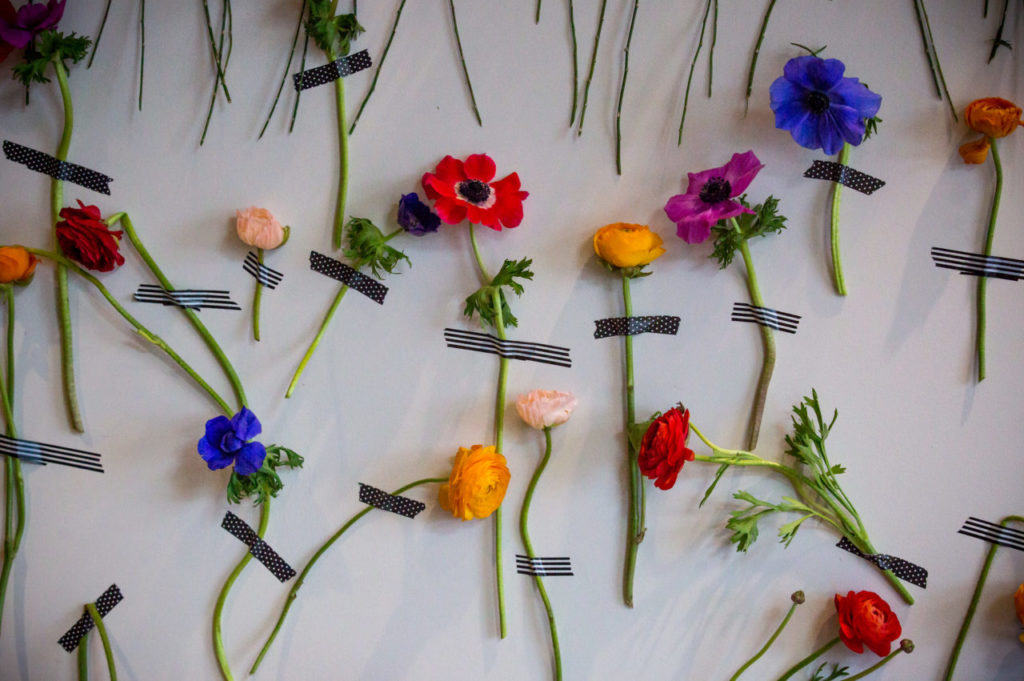 Flowers are pinned to the wall during the first annual Bubbles and Blooms Festival at Gloria Ferrer Caves and Vineyards in Sonoma, Calif., Saturday, April 10, 2016. Guests met professionals from Flower Magazine and learned creative floral arranging along with spring flower/vegetable garden tips. (Jeremy Portje / For The Press Democrat)