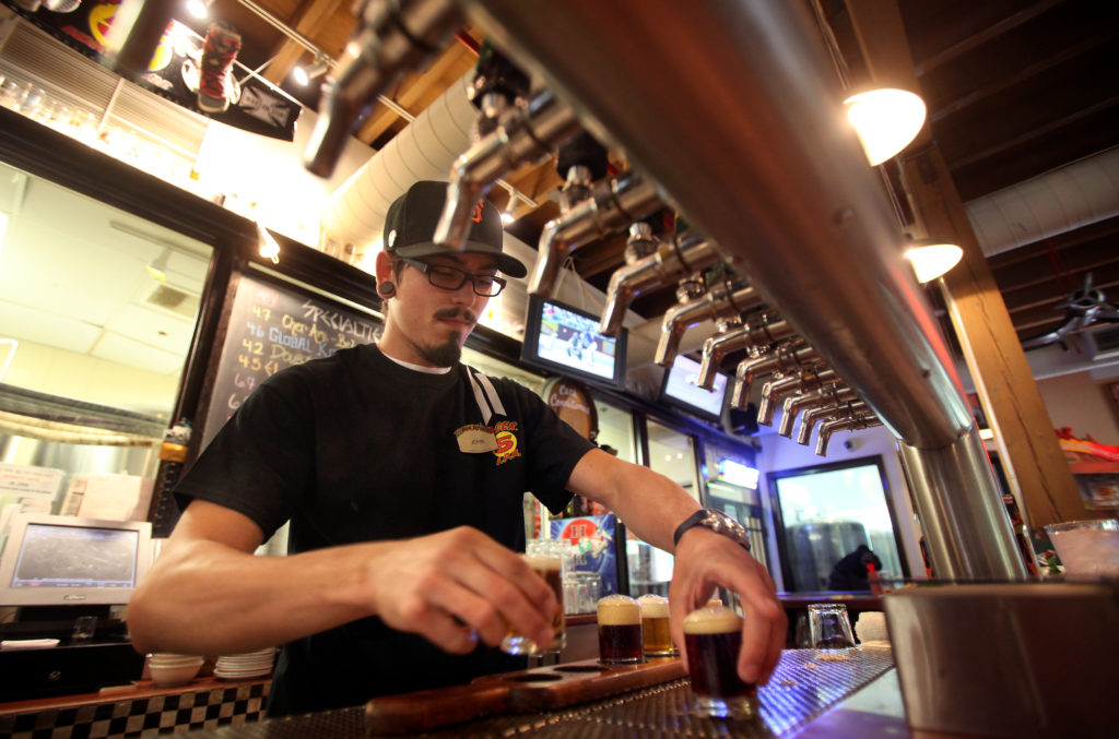 6/21/2013: B1: PC: Bartender John Clymans prepares a sampler flight of beers at Bear Republic Brewing Co., in Healdsburg, on Thursday, June 20, 2013. (Christopher Chung/ The Press Democrat)