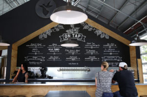 The beer menu is written on a large chalkboard behind the bar at Crooked Goat Brewing, in Sebastopol, on Wednesday, October 12, 2016. (Christopher Chung/ The Press Democrat)