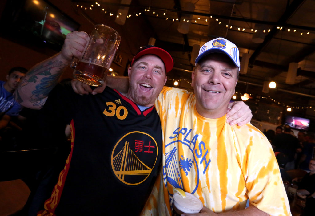 Fans watch and cheer at Sprenger's Tap Room in downtown Santa Rosa as the Golden State Warriors win their first NBA title in 40 years, Tuesday, June 16, 2015. (CRISTA JEREMIASON / The Press Democrat)