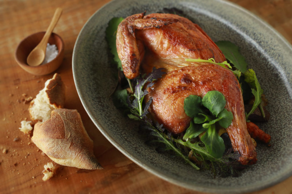 1/2 Roast Chicken from A4 Farms with seasonal vegetables & spicy greens from the Trading Post Market & Bakery in Cloverdale. (John Burgess/The Press Democrat)
