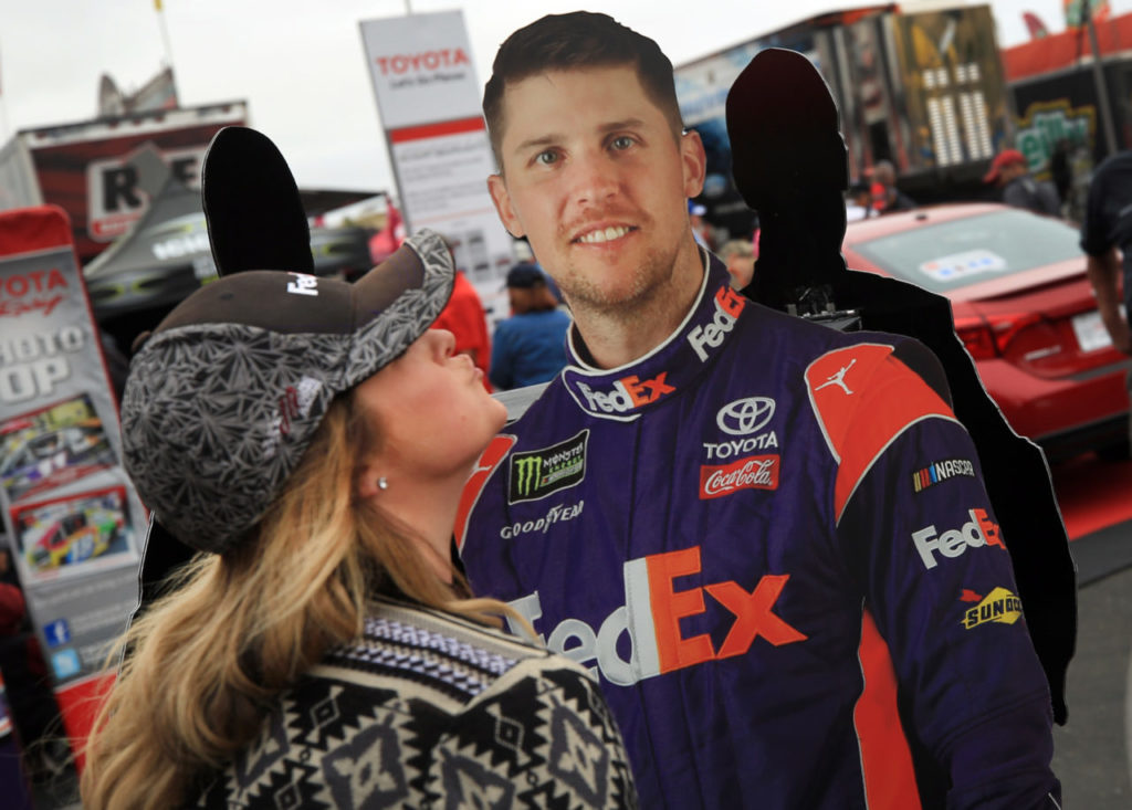 NASCAR fan Margie Hampton of Concord feigns a kiss to a Denny Hamlin cutout prior to the Toyota/Save Mart 350 at Sonoma Raceway in Sonoma, Sunday June 25, 2017. (Kent Porter / The Press Democrat) 2017