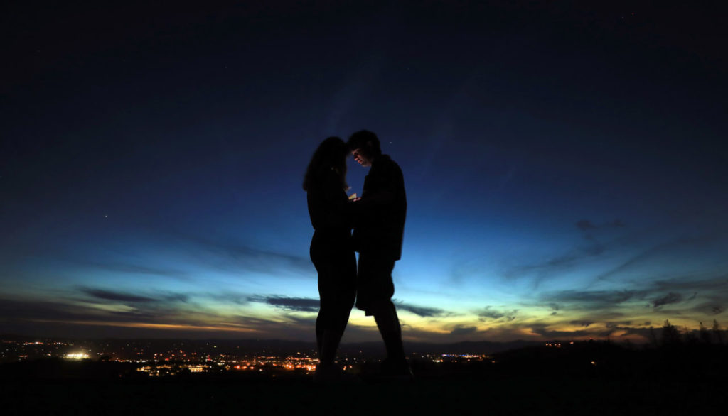 Santa rosa residents Ruby Higgins, left, and David Young look at a photograph they took while overlooking Santa Rosa from Fountaingrove, Wednesday Sept. 26, 2018. The couple took advantage of the view from the driveway of a home burned in the Tubbs fire that use to block the view of the skyline. (Kent Porter / The Press Democrat) 2018