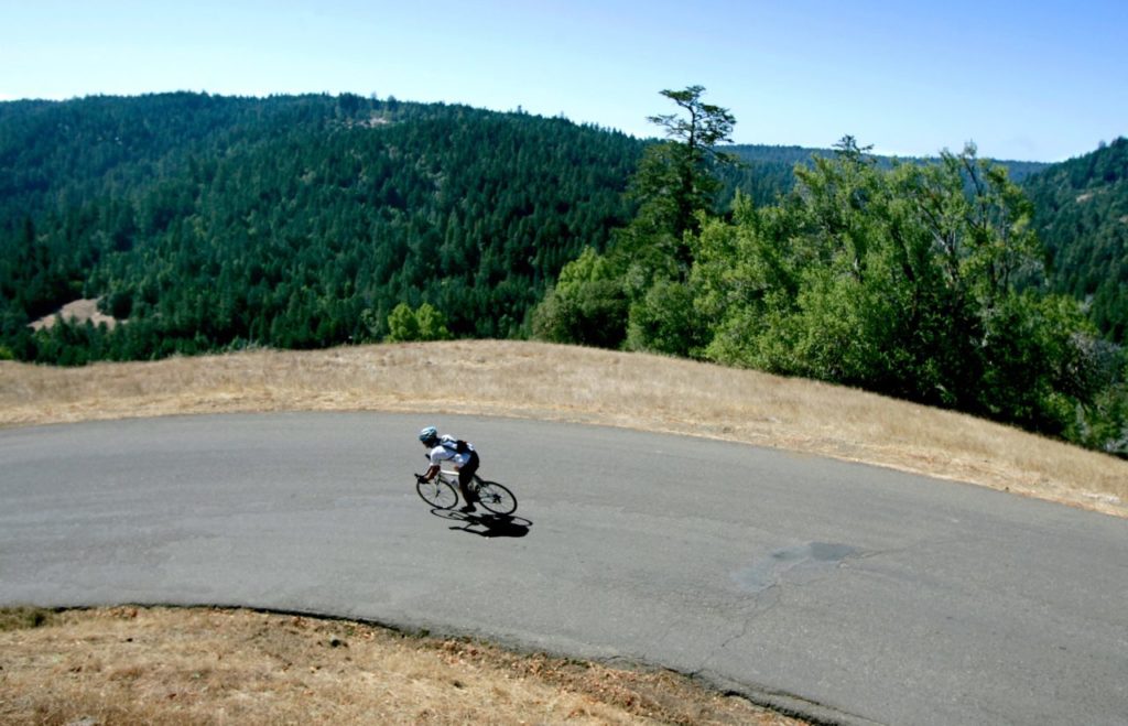 10/1/2009:A9: Paul Klassen of Santa Rosa zooms down Hauser Bridge Road on Wednesday as he traces the GranFondo route over King Ridge. Klassen will be among the participants in Saturday's 103-mile King Ridge GranFondo. PC: Paul Klassen of Santa Rosa zooms down Hauser Bridge Road, Wednesday September 30, 2009 as he traces the GranFondo route over King Ridge. After his 103 mile ride on Wednesday, Klassen will participate in Saturday's King Ridge GranFondo, pedaling another 103 miles. (Kent Porter / Press Democrat) 2009