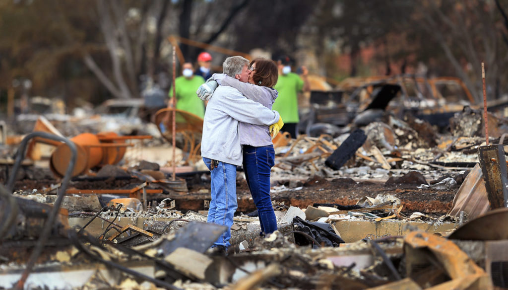 Gordon Easter and fiance Gail Hale returned to their homes on Hopper Lane in Coffey Park, Friday Oct. 20, 2017, sharing a moment of thankfulness of being alive. (Kent Porter / Press Democrat) 2017