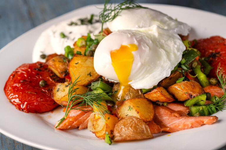Smoked Salmon Hash with house-smoked salmon, oven dried tomatoes, green onions and hash browns, two eggs any style and lemon horseradish sauce from J & M’s Midtown Cafe, Thursday, Jan. 18, 2024, in Santa Rosa. (John Burgess / The Press Democrat)