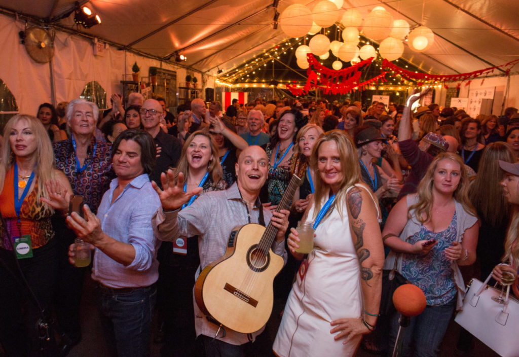 Freddy Clarke of The Freddy Clarke Wobbly World Band takes a photos with guests as he preforms during Vamos al Cine Å Fiesta as pat of the 18th Annual Sonoma International Film Festival Saturday was held in downtown Sonoma, Calif. March 25-29, 2015. The Festival is billed as "An intimate celebration of unforgettable cinema..."