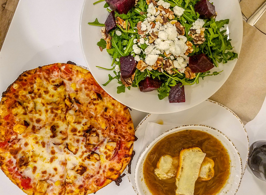Pizza, french onion soup and beet salad at The Grove inside RCU in Santa Rosa. Heather Irwin/PD