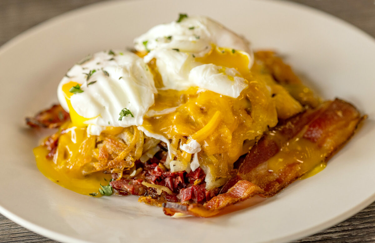 Smoked Salmon Hash with house-smoked salmon, oven dried tomatoes, green onions and hash browns, two eggs any style and lemon horseradish sauce from J & M’s Midtown Cafe, Thursday, Jan. 18, 2024, in Santa Rosa. (John Burgess / The Press Democrat)