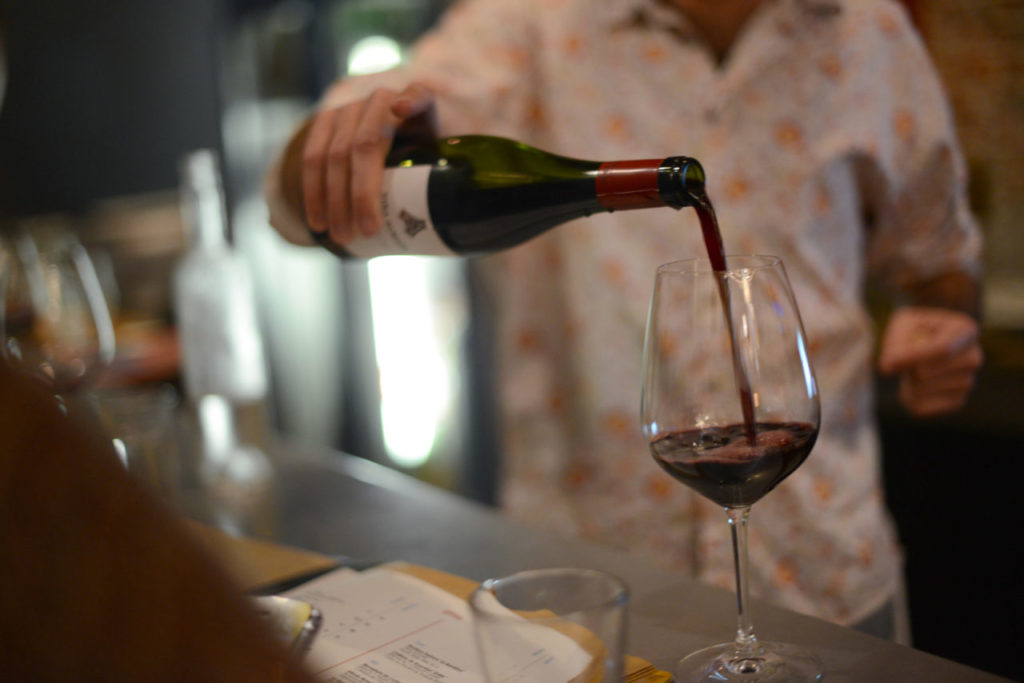 Bergamot Alley Bar & Wine Merchants owner Kevin Wardell pouring a glass of 2012 Viña Almate by producer Alfredo Maestro at his Healdsburg bar. You can sample a large selection of eclectic Old World wines while watching a free movie screening every Monday night. February 24, 2014. (Photo: Erik Castro/for The Press Democrat)