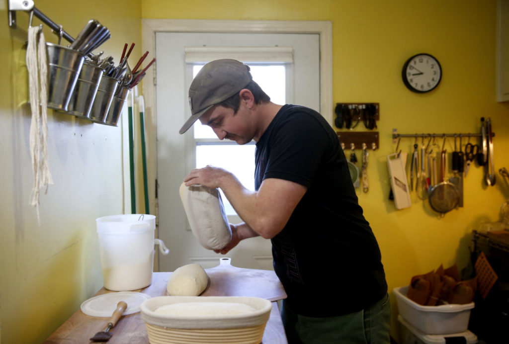 Ian Conover, an owner of Relax and Eat Bread, bakes loaves of fresh bread in his kitchen on Thursday, February 15, 2018 in Sonoma, California . (BETH SCHLANKER/The Press Democrat)