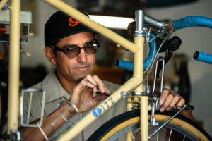 Tom Fitzgerald making a bike frame in his garage/workshop