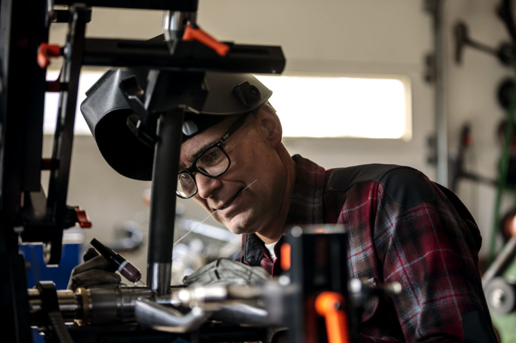 Curtis Inglis welding a frame on a new bike