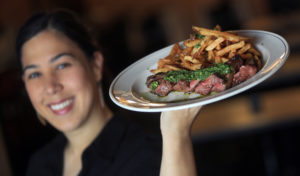 BN Ranch Hanger Steak with Jalapeno charmoula, demi-glace, salt and pepper frites at Seared in Petaluma. (Kent Porter / The Press Democrat)