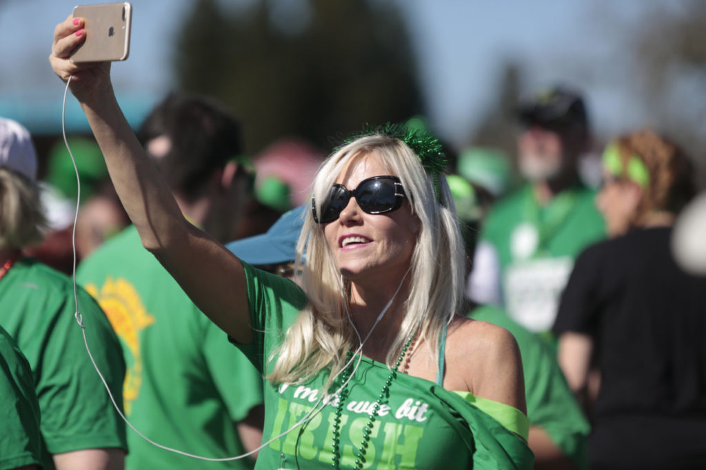 Rhonda Alderman takes a selfie before the start of the St. Patrick's Day 5K all-ages race, on Sunday, March 12, 2017 in Santa Rosa, California. Participants received a commemorative mug at the finish line and there was even a little leprechaun dash for the kids 5 and under. RAMIN RAHIMIAN for The Press Democrat)