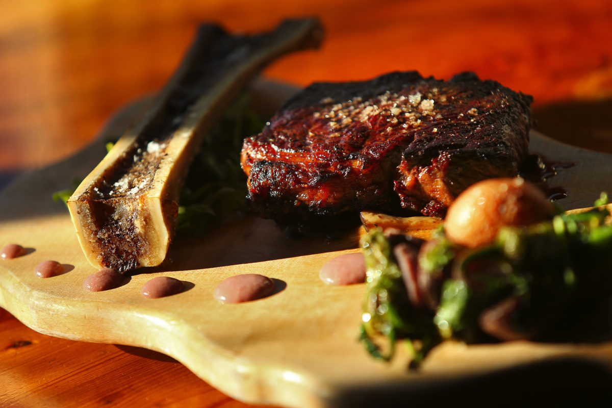 Peppercorn crusted New York steak with wild mushroom fondue, and roasted bone marrow, served with potato and pepper hash, by chef Dustin Valette at his Valette restaurant in Healdsburg. (Christopher Chung/The Press Democrat)
