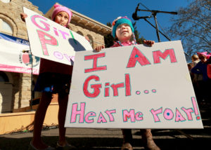 Tessa, 6, left, and Joey White, 2, brought their girl power posters to the Women's March in Sonoma on Saturday. (photo by John Burgess/The Press Democrat)