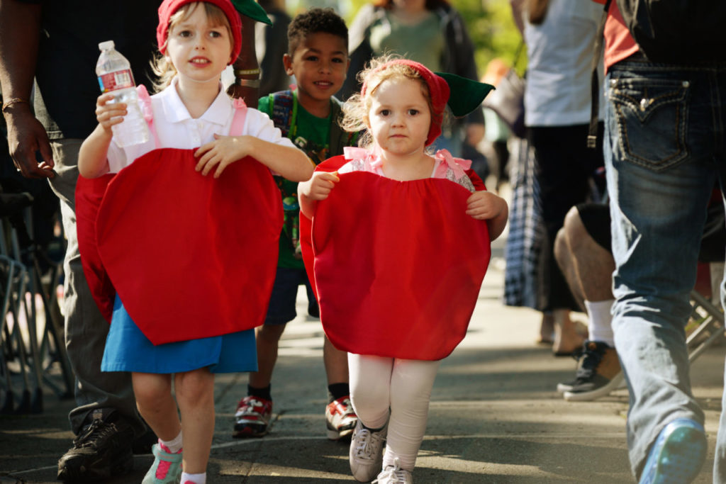 Nevaeh Fitzsimmons, 6, left, and Kayla Fitzsimmons, 3, heading up North Main Street before the start of the 70th annual Apple Blossom Parade held in Sebastopol Saturday. April 16, 2016. (Photo: Erik Castro/for The Press Democrat)