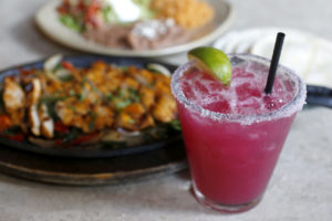 A Prickly Pear Margarita with chicken fajitas at La Rosa Tequileria & Grille in Santa Rosa, on Tuesday, August 11, 2015. (BETH SCHLANKER/ The Press Democrat)