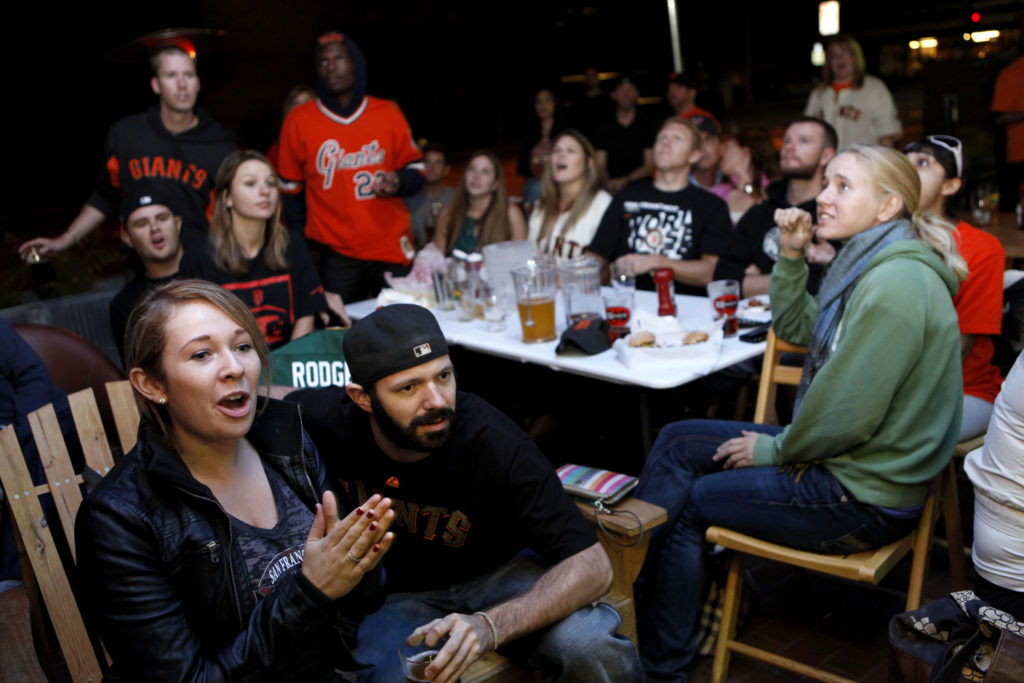Danielle Sawyer and her boyfriend Marshall McNatt watch Game 4 of the 2012 World Series against the Detroit Tigers at Sprenger's Tap Room in Santa Rosa, California on Sunday, October 28, 2012. (BETH SCHLANKER/ The Press Democrat)
