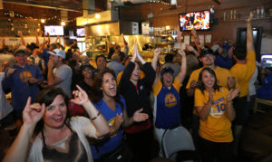 Fans watch and cheer at Sprenger's Tap Room in downtown Santa Rosa as the Golden State Warriors win their first NBA title in 40 years, Tuesday, June 16, 2015. (CRISTA JEREMIASON / The Press Democrat)