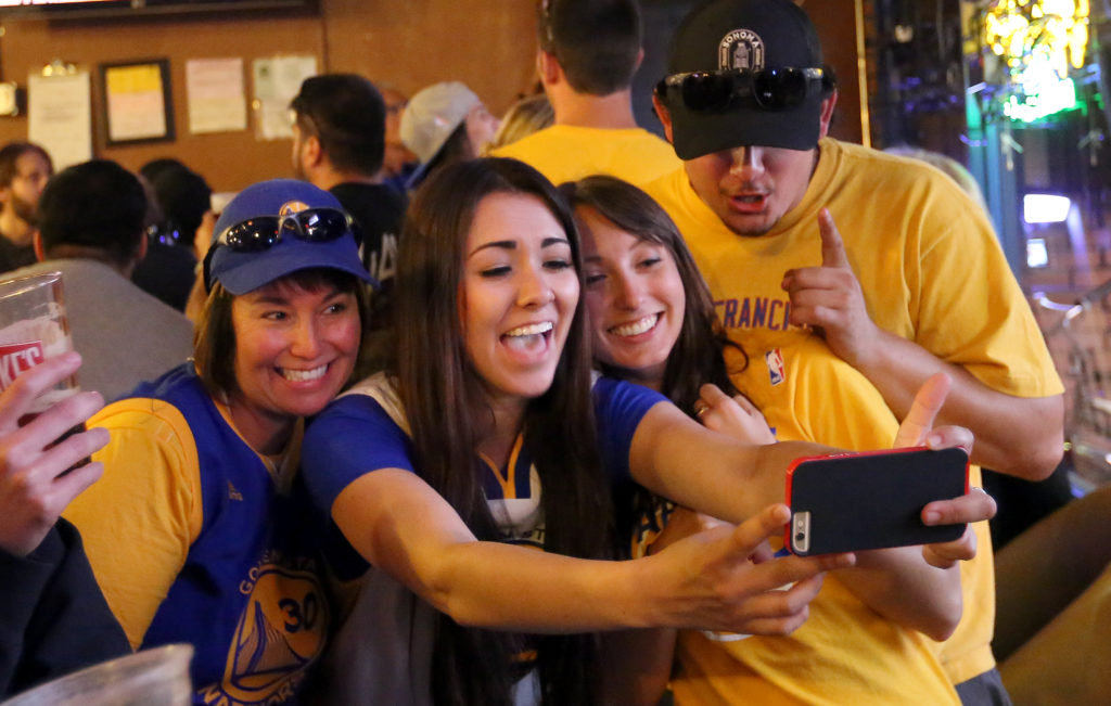 Fans watch and cheer at Sprenger's Tap Room in downtown Santa Rosa as the Golden State Warriors win their first NBA title in 40 years, Tuesday, June 16, 2015. (CRISTA JEREMIASON / The Press Democrat)