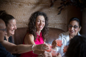 Danielle Alvarez, center, toasts to friends and family during a special dinner menu at Mateo's Cocina Latina in Healdsburg, Calif. Saturday, June 25, 2016. Mateo's Cocina Latina is beginning to offer sustainable feasts that include every part of the animals butchered for the dinner, including suckling pig brain mousse and pigs tails. (Jeremy Portje / For The Press Democrat)