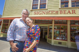 Stephen and Laura Havlek, proprietors of the Sign of the Bear kitchenware and tableware shop, in front of their First Street West location. (Photo by Robbi Pengelly/Index-Tribune)