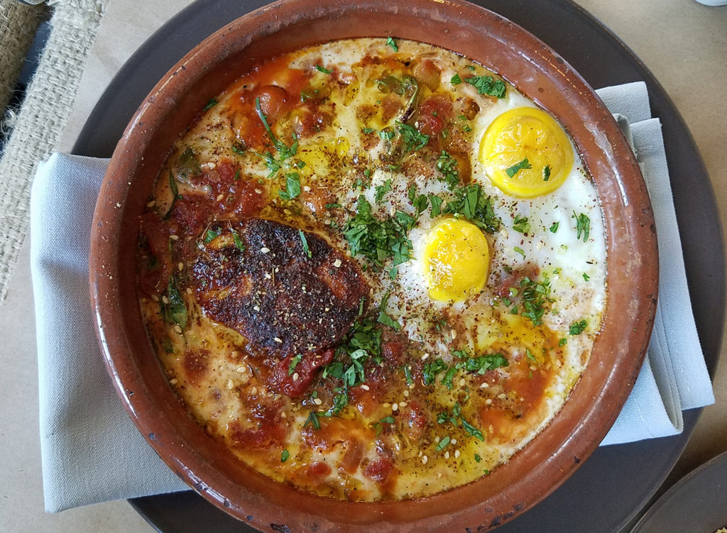 Shakshuka with chickpeas, favas and tomato stew, griddled Halloumi cheese, baked egg at Pearl restaurant in Petaluma Heather Irwin/PD