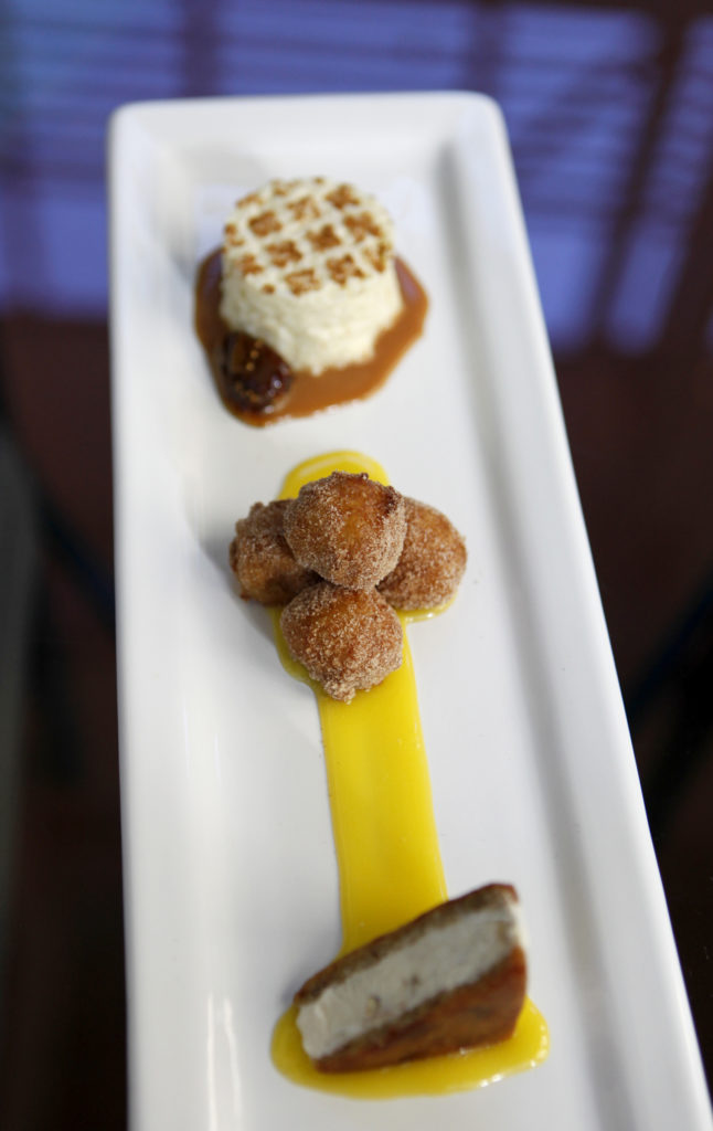1/20/2013: D3: PC: The "Traditional" dessert at Cafe Lucia includes arroz doce with braised figs, malassadinas, and an almond ice cream sandwich in Healdsburg, California on Friday, January 11, 2013. (BETH SCHLANKER/ The Press Democrat)