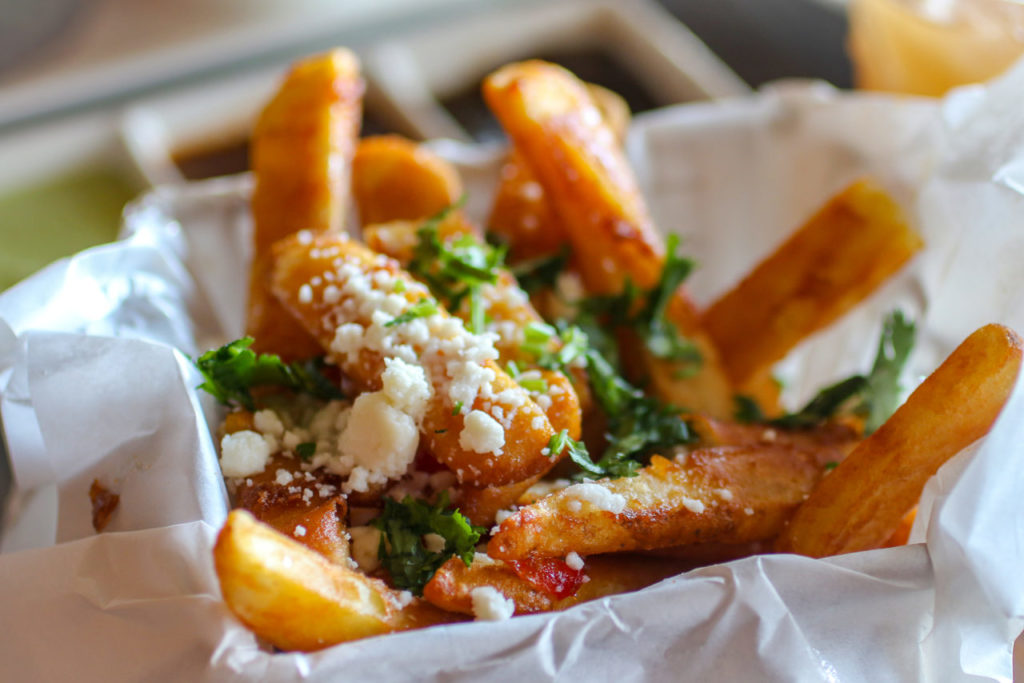 Cascabel fries with jalapeno jelly, cheese and cilantro at Cascabel Mexican restaurant and grill in Santa Rosa. (Photo by Heather Irwin)